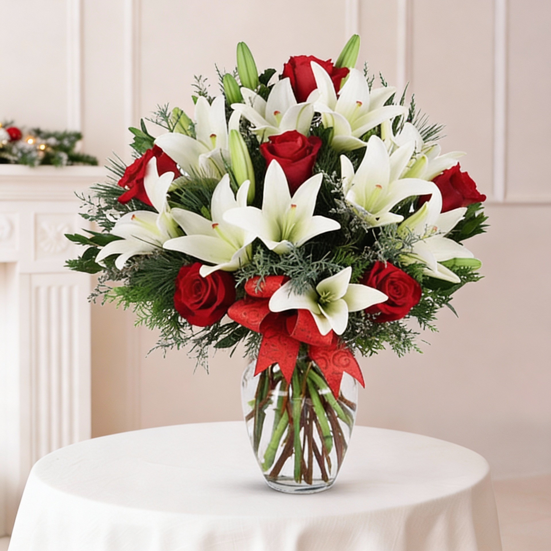 Clear glass vase arrangement of white lilies and red roses for online flower delivery