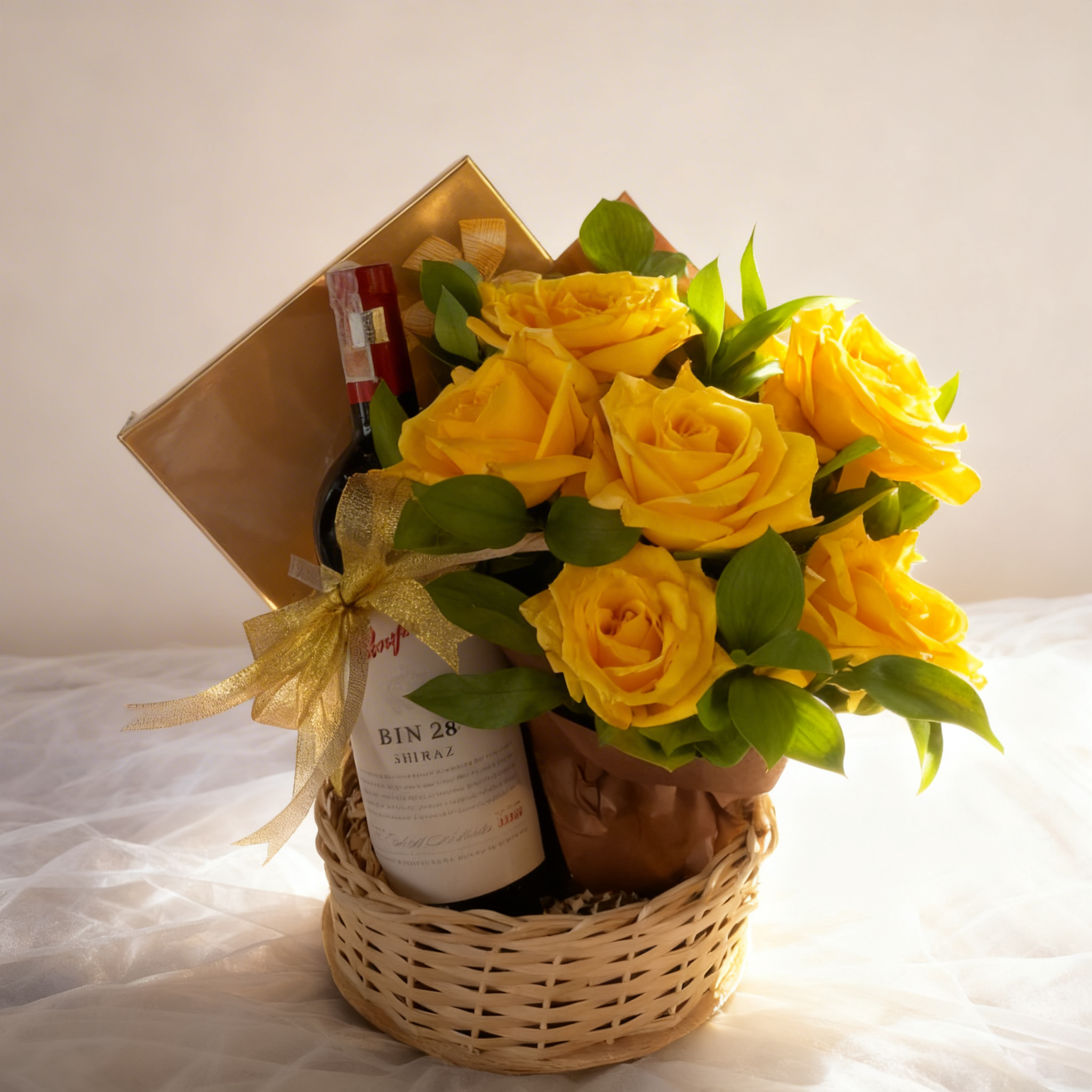 Golden Moments Gift Trio with yellow roses, red wine, and Lindt Lindor chocolates