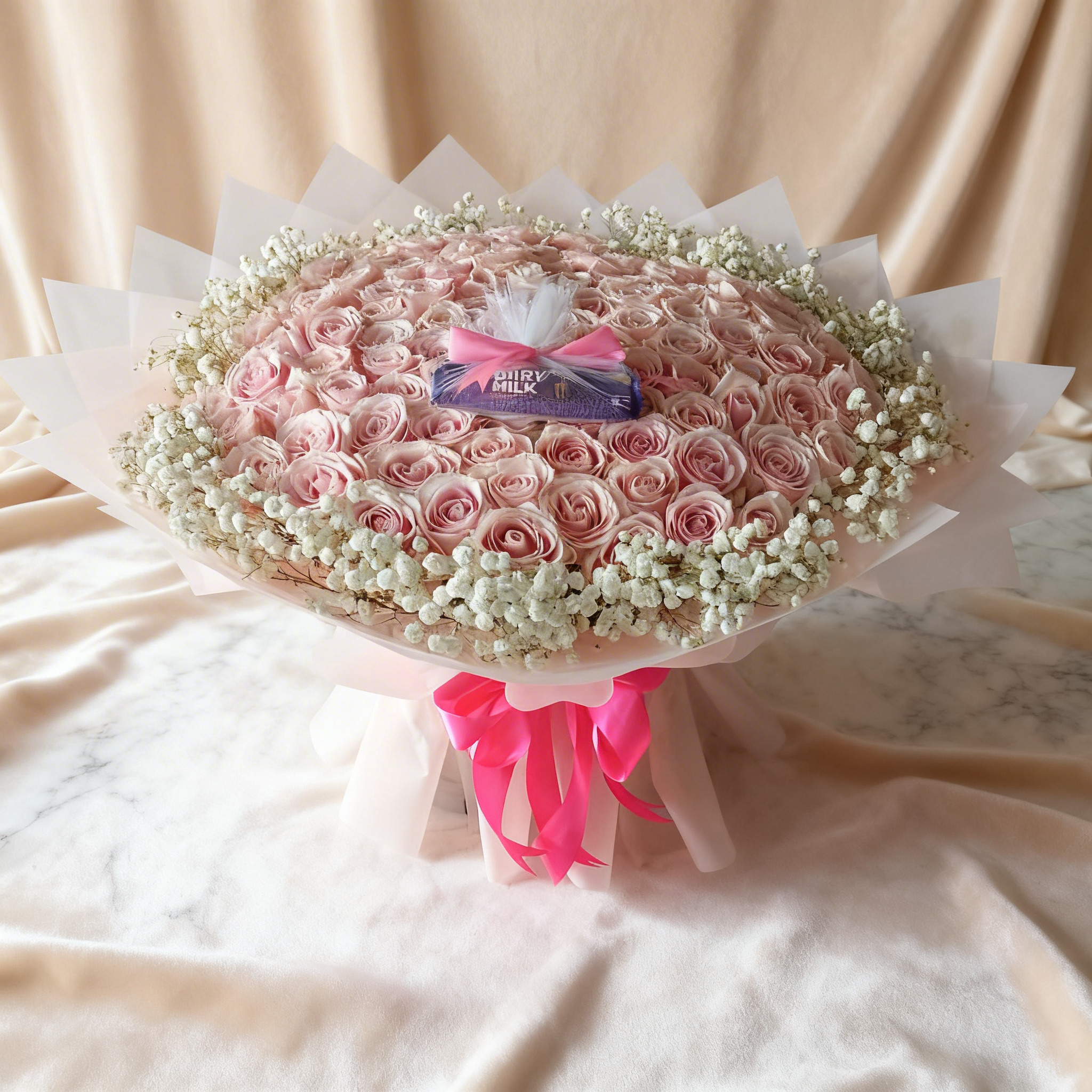 100 pink roses bouquet in net wrapping